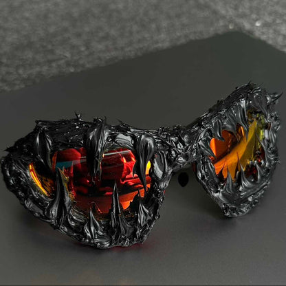 Glowing black and orange sunglasses with a dark background