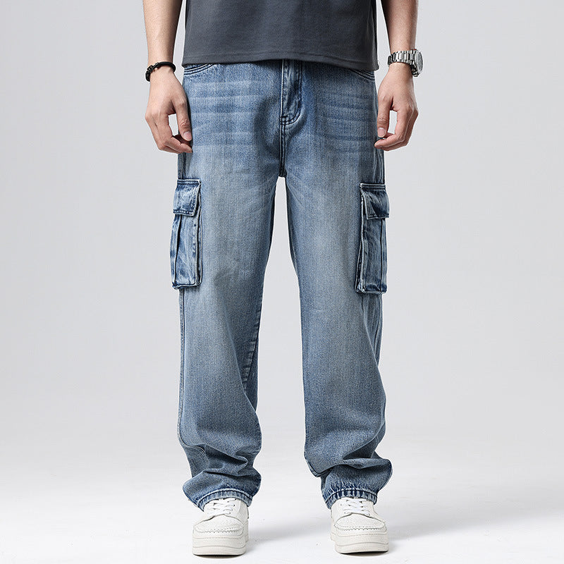 Person wearing light blue cargo jeans on a plain background