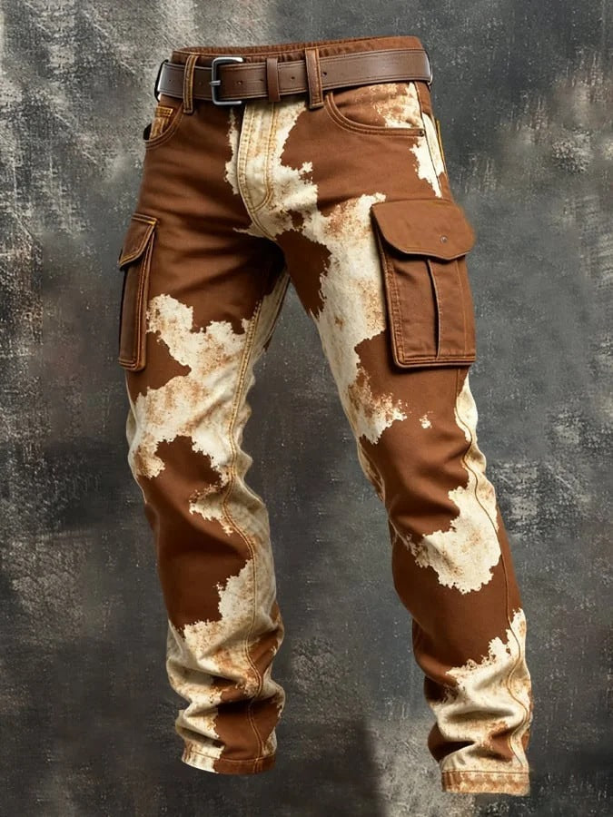 Brown and beige camouflage pants on a textured gray background