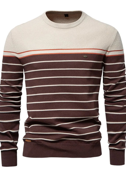 Beige and brown striped sweater on a white background