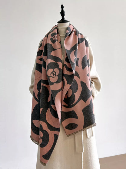 Mannequin wearing a patterned scarf with a plain background