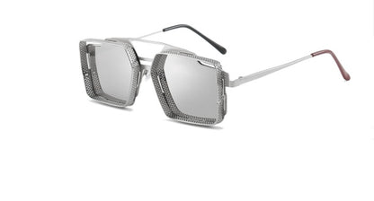 Silver sunglasses with reflective lenses on a white background