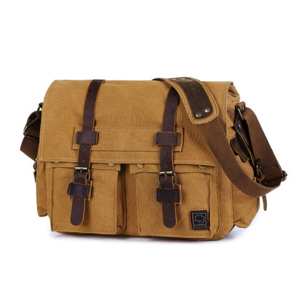 Brown leather messenger bag with multiple pockets on a white background