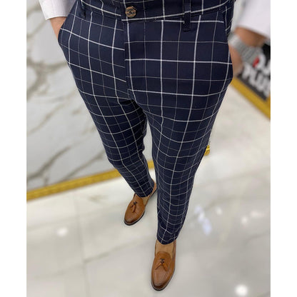 Navy checkered pants worn by a person on a light background