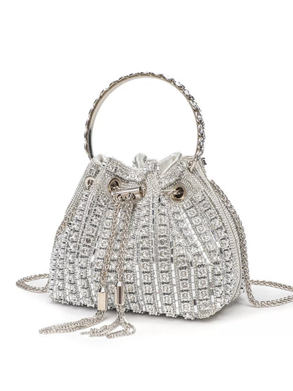 Silver embellished handbag with chain strap on a white background