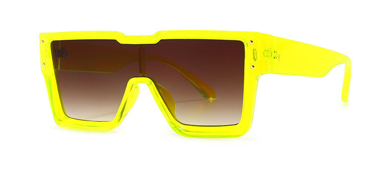 Yellow sunglasses with a gradient lens on a white background