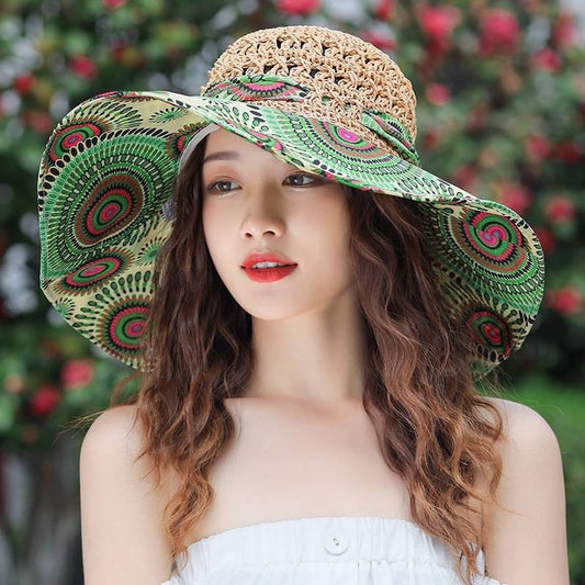 Woman wearing a decorative hat with a green and brown pattern against a blurred natural background