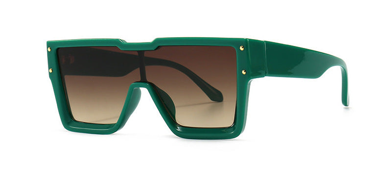 Green sunglasses with gold accents on a white background