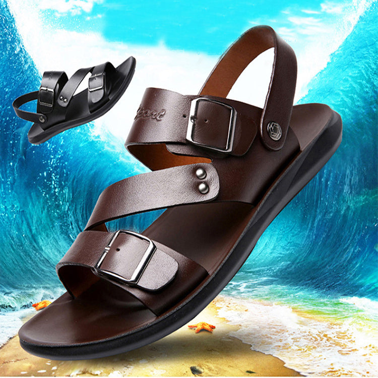 Brown sandals with buckles on a beach background