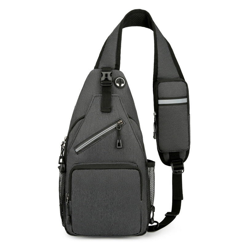 Gray sling bag with multiple pockets and zippers on a white background