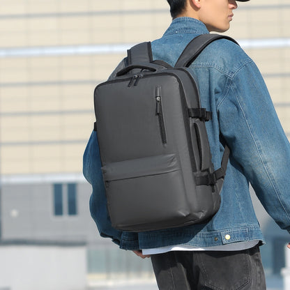 Person wearing a black backpack outdoors