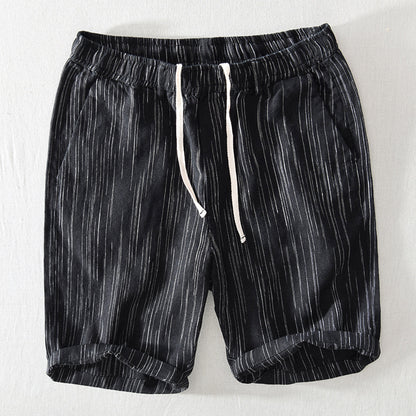 Black shorts with white stripes on a white background