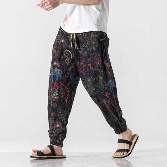 Colorful patterned harem pants worn by a person on a white background