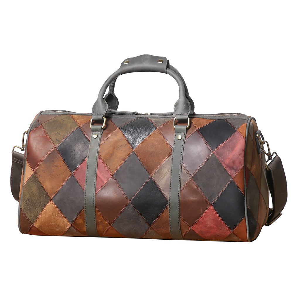 Patchwork leather duffel bag with diamond pattern on a white background