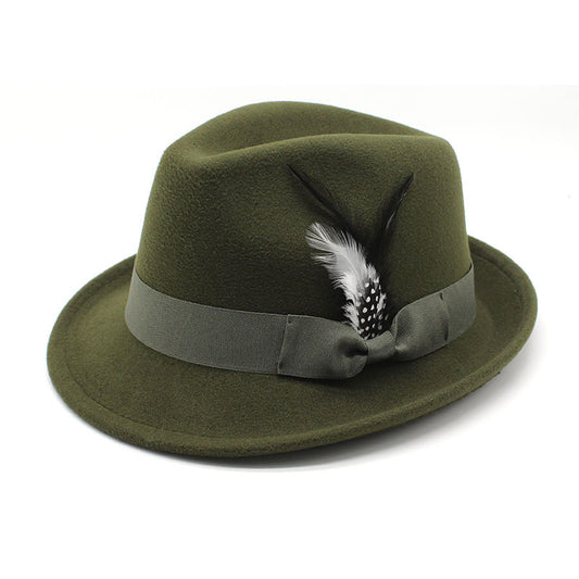 Green fedora hat with a feather and ribbon on a white background