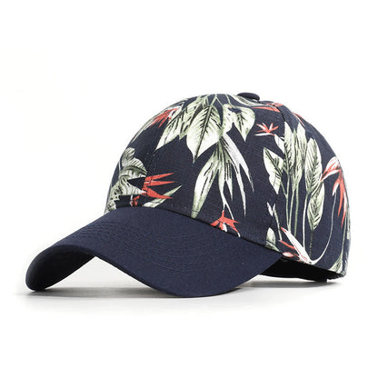 Navy blue cap with tropical leaf pattern on a white background