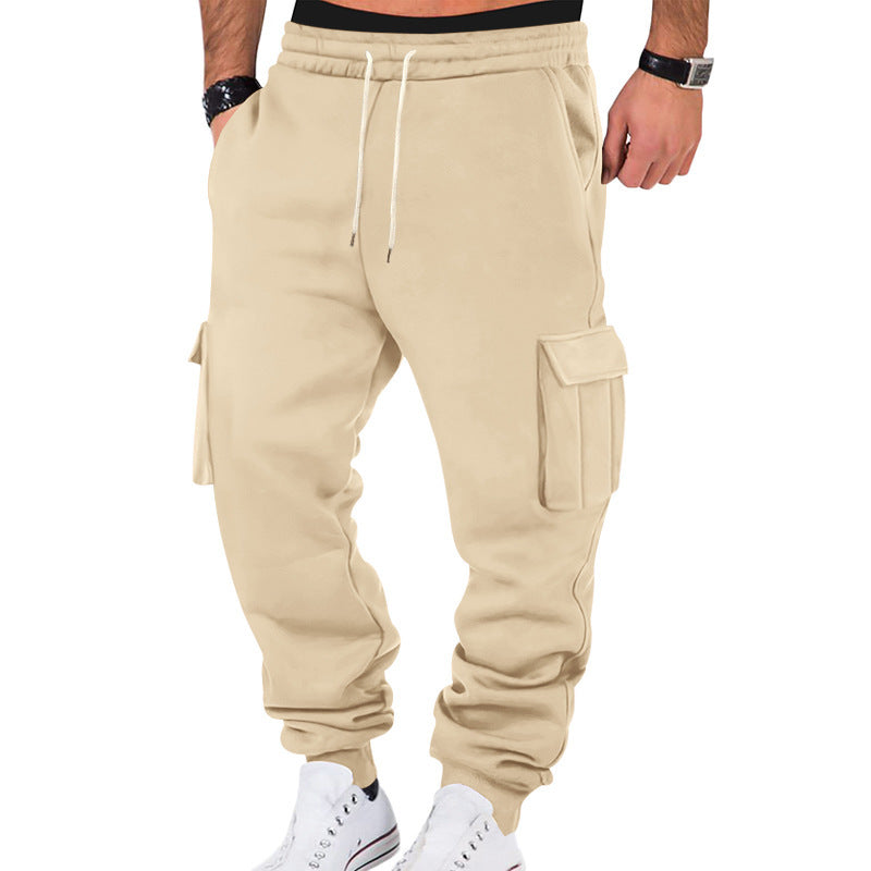 Beige cargo jogger pants worn by a person on a white background