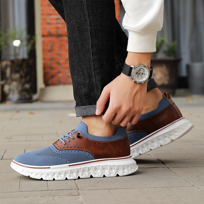 Person wearing blue and brown sneakers with a watch on a blurred background
