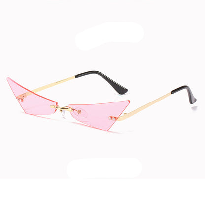 Sunglasses with pink lenses and gold frames on a white background