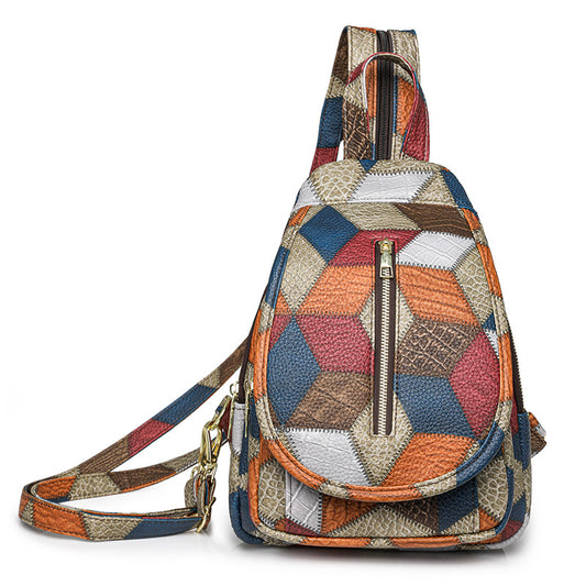 Multicolored patchwork backpack with geometric pattern on a white background