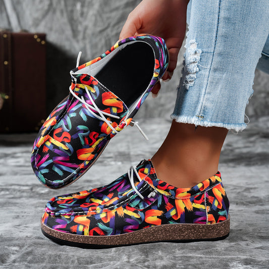 Colorful patterned shoes worn with a blurred background