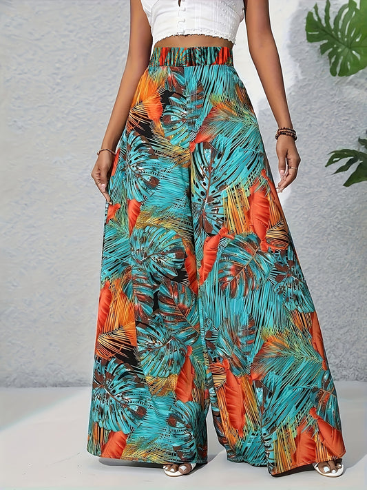 Colorful tropical print pants worn by a person on a neutral background