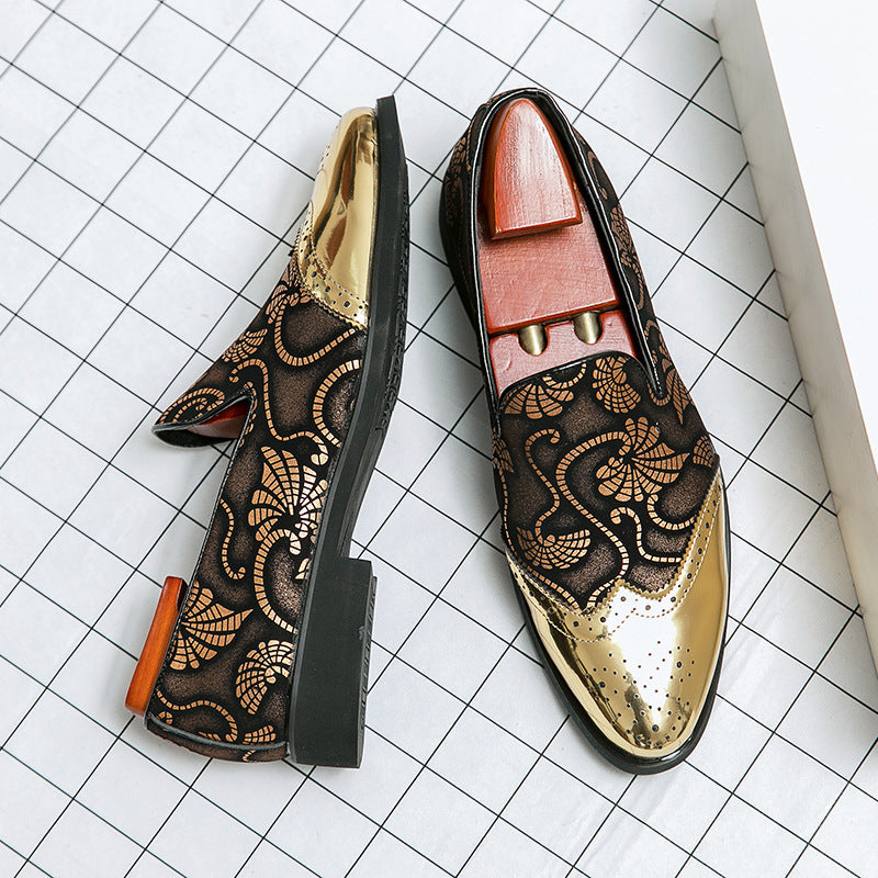 Pair of ornate loafers on a grid background