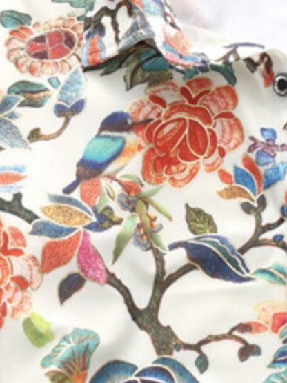 Close-up of a shirt with colorful floral and bird pattern