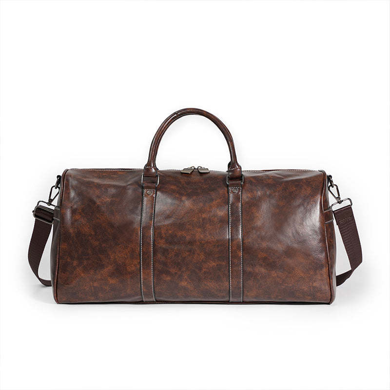 Brown leather duffel bag on a white background