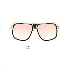 Sunglasses with gold frame and pink-tinted lenses on a white background