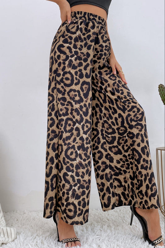 Leopard print pants worn by a person on a white background
