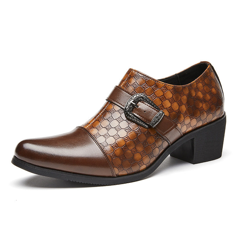 Brown leather shoe with a patterned design and buckle on a white background