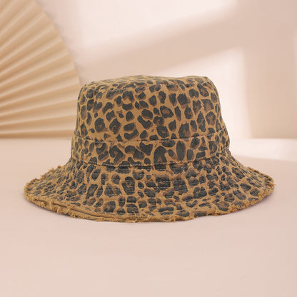 Leopard print bucket hat on a light pink background