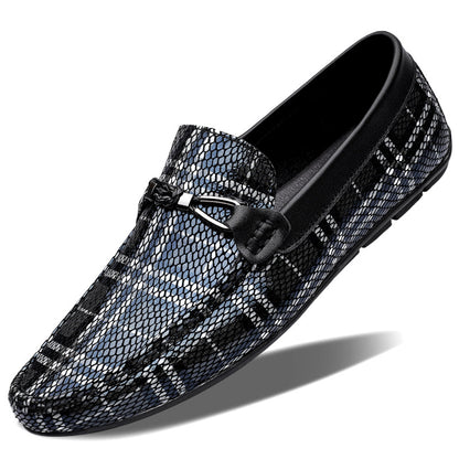 Black and gray patterned loafer shoe on a white background
