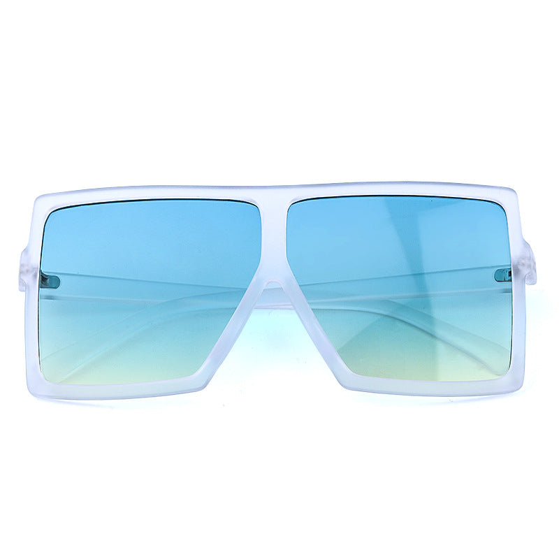 Sunglasses with white frame and blue gradient lenses on a white background