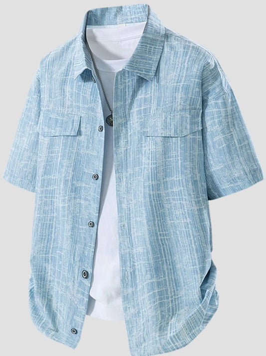 Light blue plaid shirt with short sleeves on a white background