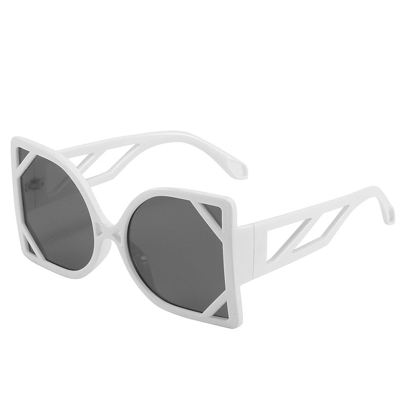 White sunglasses with a geometric frame on a white background