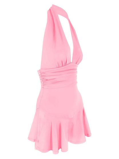 Pink halter neck dress on a white background