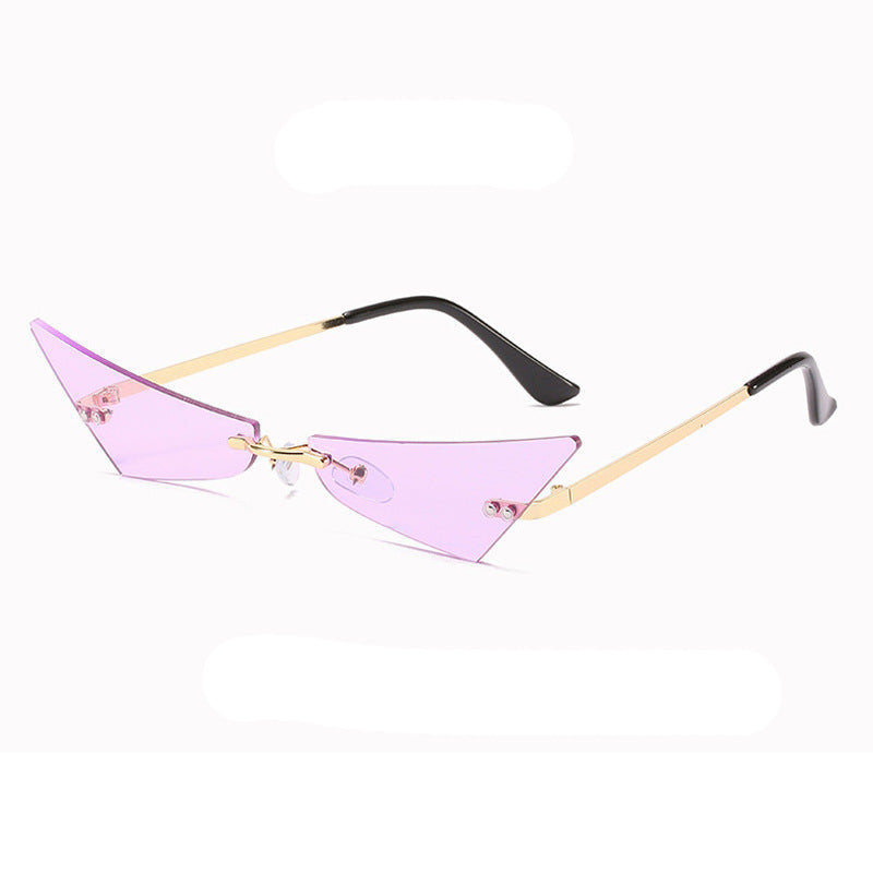 Sunglasses with pink lenses and gold frames on a white background
