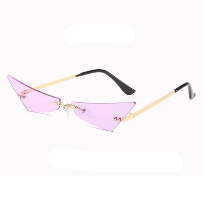 Sunglasses with pink lenses and gold frames on a white background