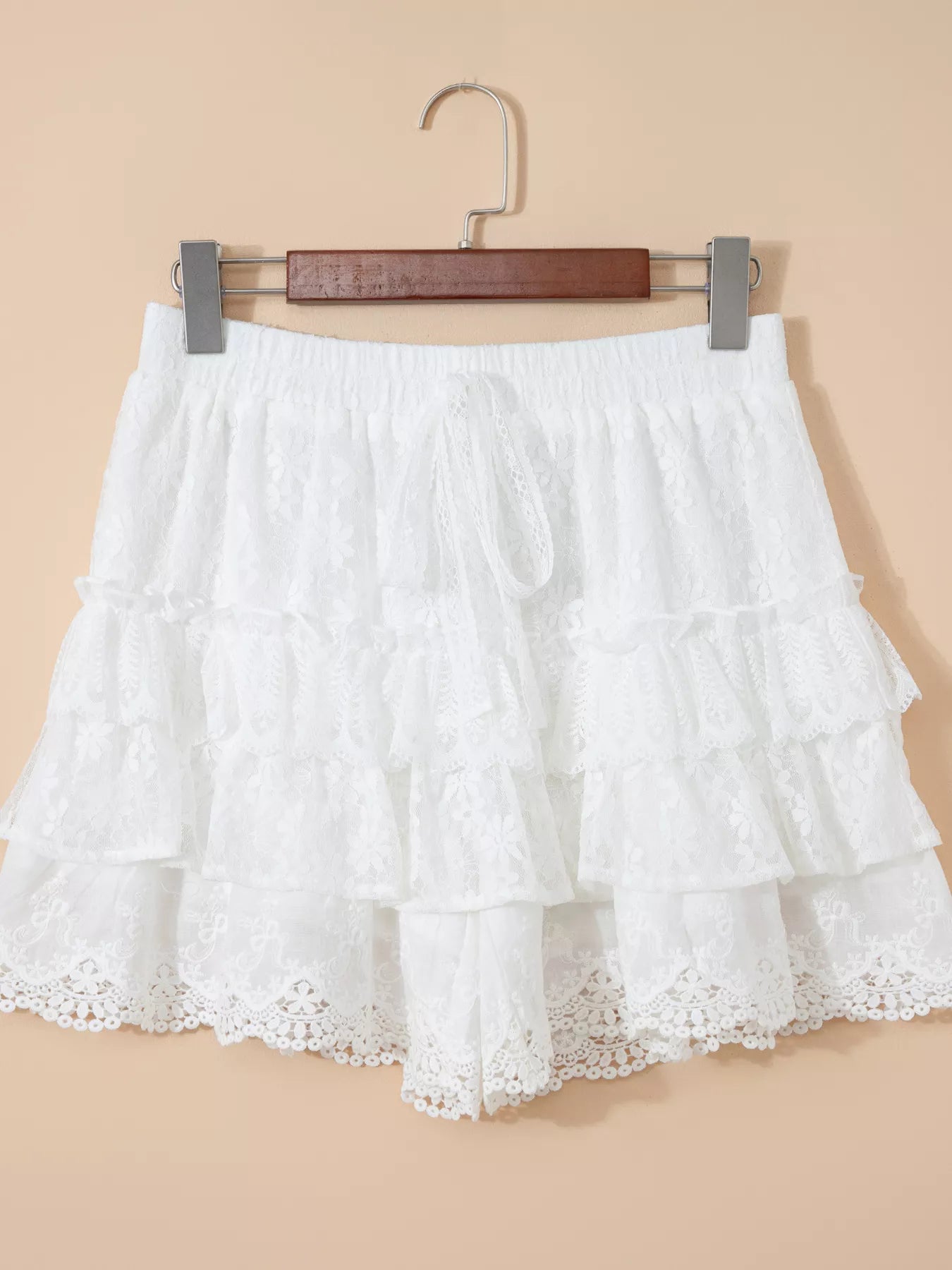 White lace skirt on a beige background
