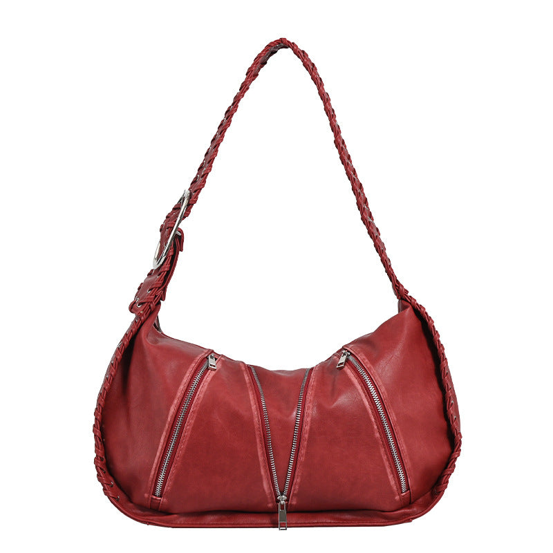 Shoulder bag with zipper details on a white background.