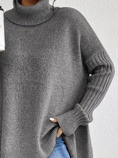 Gray turtleneck sweater worn by a person against a white background