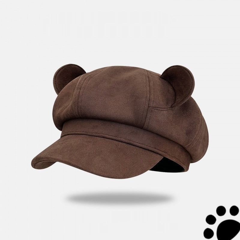 Brown cap with bear ears on a light gray background