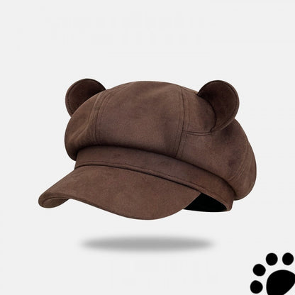 Brown cap with bear ears on a light gray background