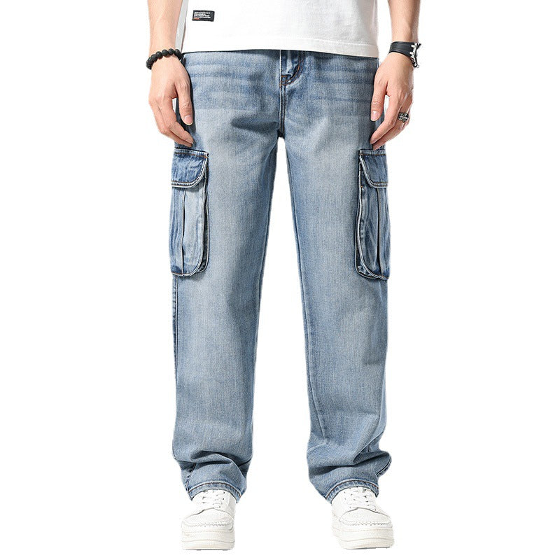 Blue jeans with cargo pockets worn by a person on a white background