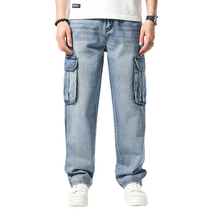 Blue jeans with cargo pockets worn by a person on a white background