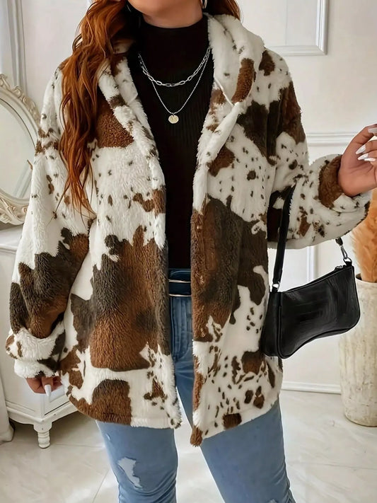Person wearing a cow print coat in an indoor setting