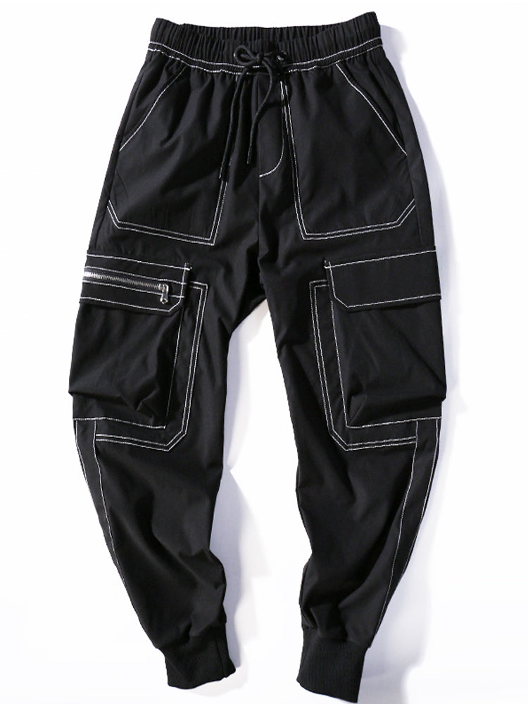 Black cargo pants with white stitching on a white background