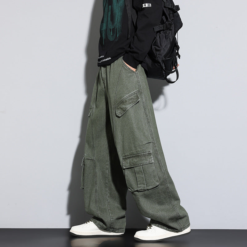 Person wearing green cargo pants with a plain background